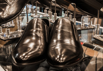 Set of black and brown mens luxury shoes in the store