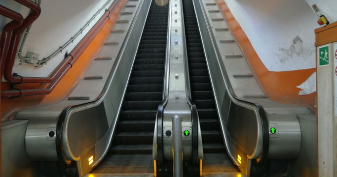 Empty underground escalator moving up