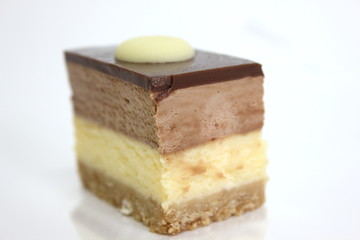  chocolate cheesecake with  on a white background.