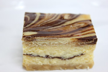  chocolate cheesecake with  on a white background.