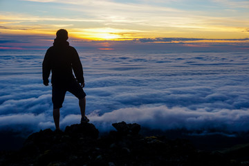 Watching the sunset above the clouds