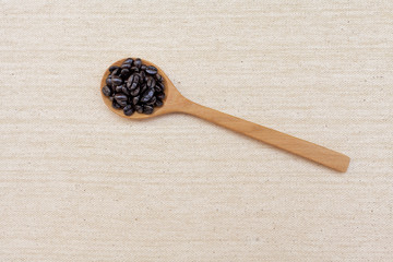 Coffee beans and wooden spoon 