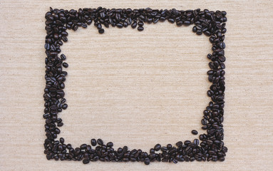 Coffee beans frame on canvas texture background