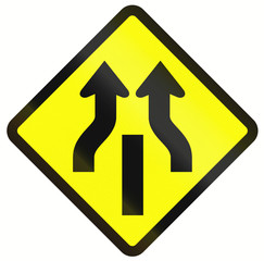 Indonesian road warning sign: Central Reserve With One Way Traffic Ends