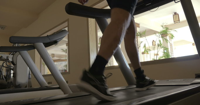 Stepping on treadmill in the gym