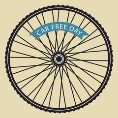 Obraz premium Bicycle wheel with car free day banner