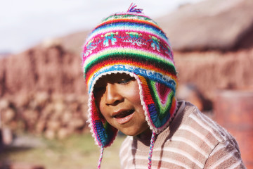 Peruvian boy with chullo - obrazy, fototapety, plakaty
