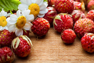 Strawberries and chamomile flowers