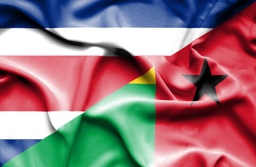 Fototapeta premium Waving flag of Guinea Bissau and Costa Rica