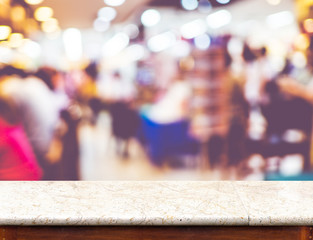 Empty marble table top and blurred restaurant bokeh light in bac