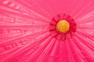Pink umbrella handmade on white background