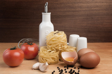 Still life with traditional italian pasta and ingredients