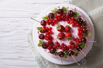 cake with red ripe berries horizontal top view close-up
