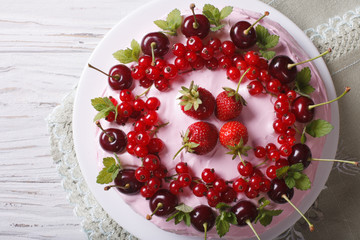 cake with cherries, currants and strawberries close-up
