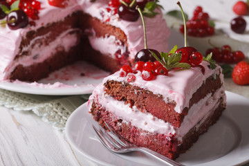 Slice of homemade berry cake with pink cream horizontal
