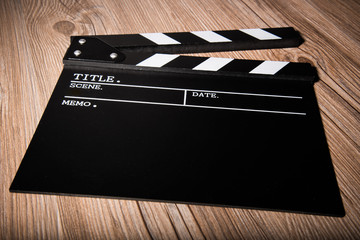 movie clapper on wooden background