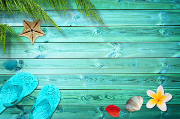 Summer background with palm trees, flip flops and sea shells