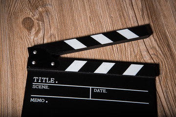 movie clapper on wooden background