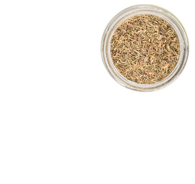 Dried thyme herbs in a mason jar over white background
