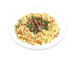 Pilaf with meat and greens on a plate
