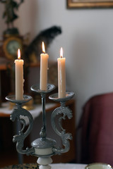 Candles in candlestick in vintage style