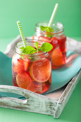 summer strawberry lemonade with lime and mint in jars