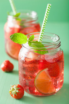 summer strawberry lemonade with lime and mint in jars