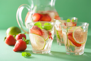 refreshing summer drink with strawberry cucumber lime in jar and
