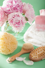 bath and spa with peony flowers brush sponge towels