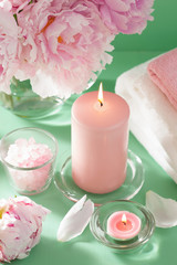 Obraz na płótnie Canvas bath and spa with peony flowers candles towels
