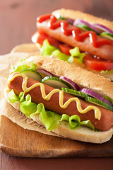 hotdog with ketchup mustard and vegetables