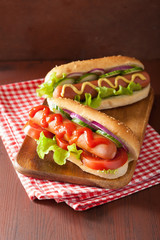 hotdog with ketchup mustard and vegetables