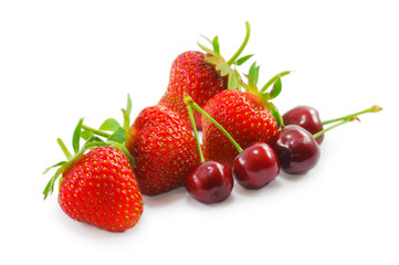 strawberries and cherries isolated on a white background