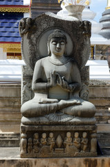 Ancient sandstone buddha statues in the temple