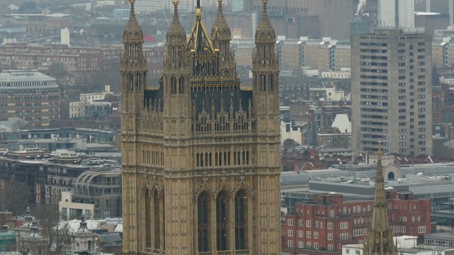 One of tallest buildings in London with a flag on top. Located in the center of the city with the river beside in 4K