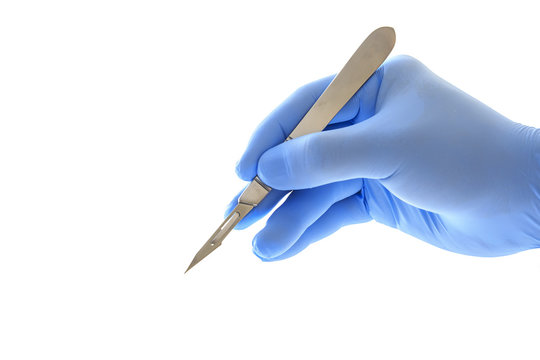 Doctor's hand holding a scalpel