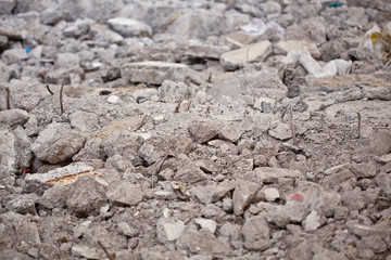 Close-up photo of a pile broken concrete blocks