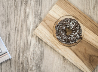 Top view shot,Chocolate Donut on wooden background