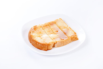 Slice of bread toasted on white dish