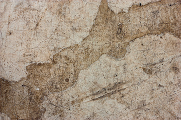 Cement floors are old and dirty.