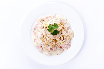 Pasta carbonara with bacon on white background