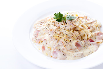 Pasta carbonara with bacon on white background
