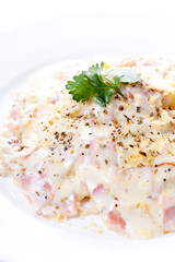 Pasta carbonara with bacon on white background