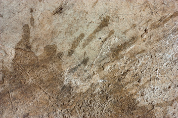 Cement floors are old and dirty.