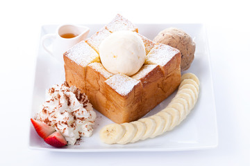 Honey toast with vanilla ice-cream and whipping cream, honey, Strawberry and banana slices