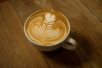 coffee latte art in cofeee sbop vintage color tone