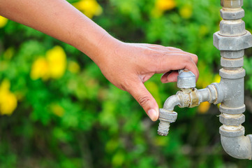 turn off water with green  leaf  background