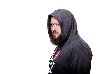 Adult man in the hood sits thinking. Isolated on white backgroun