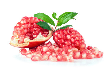 Ripe pomegranates with leaves isolated on a white background