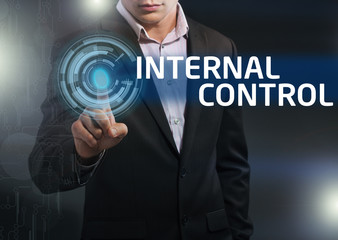 Businessman presses button internal control on virtual screens.